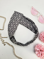 Load image into Gallery viewer, Handmade grey logo print crossed hair holder secure headband
