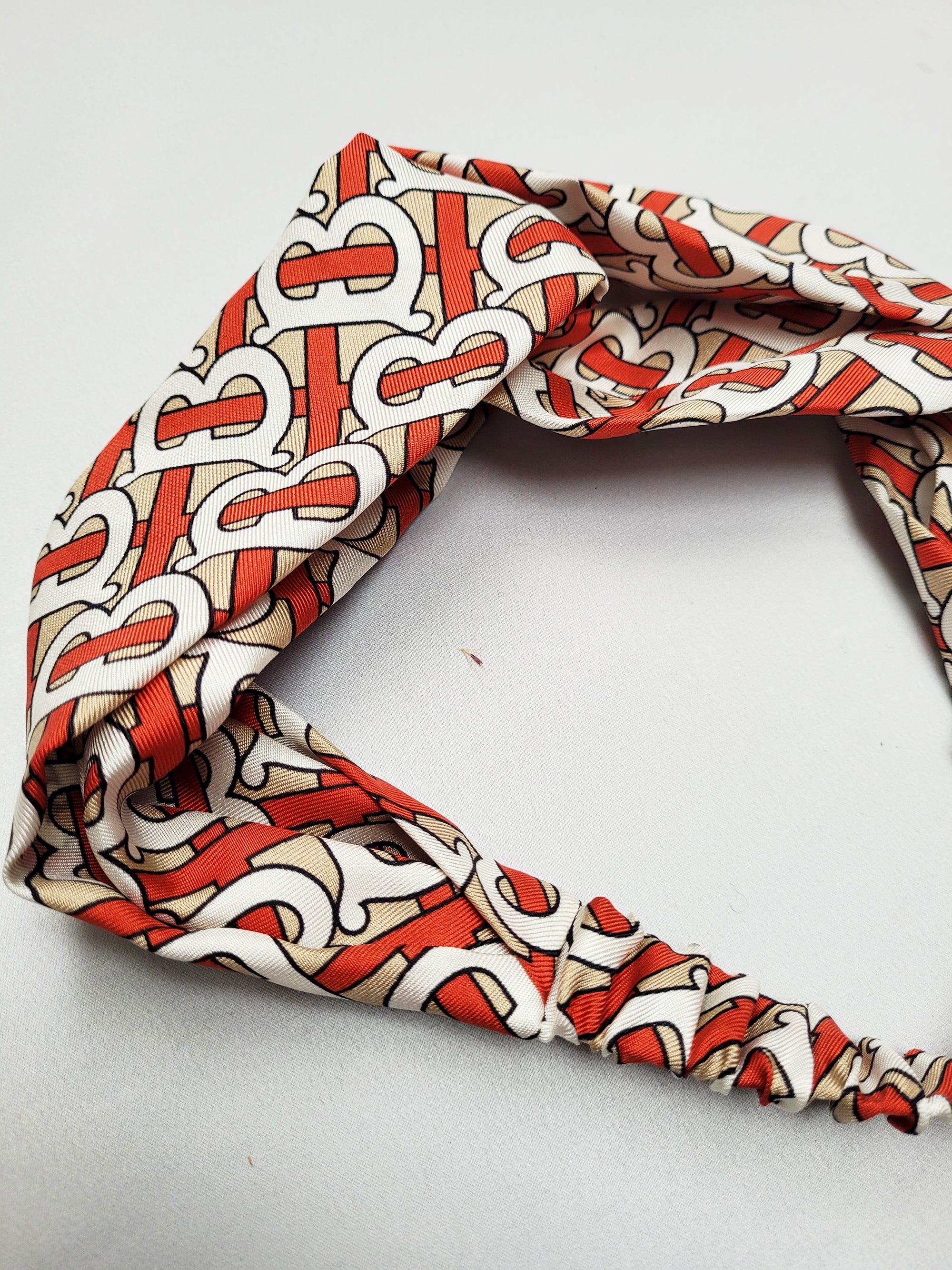 Handmade red logo print crossed hair holder secure headband