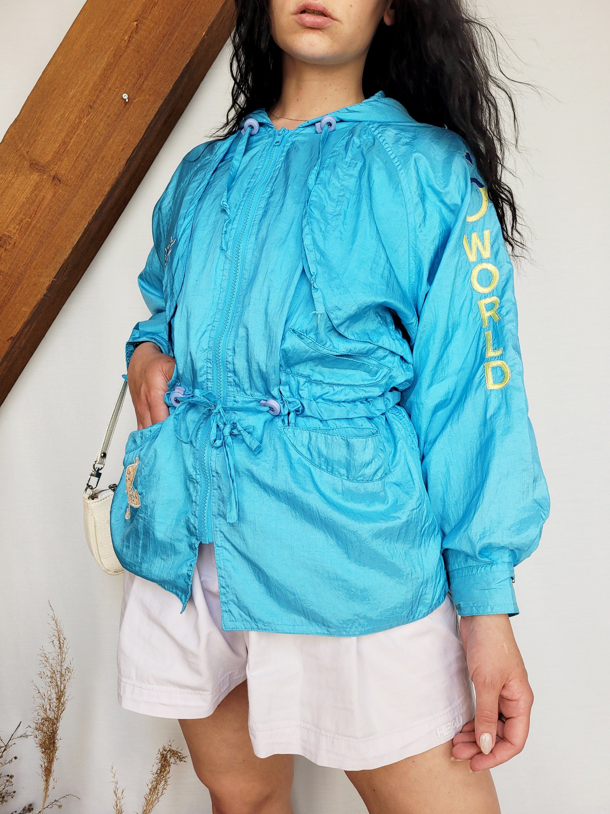 Vintage 90s blue embroidered shell hooded windbreak jacket